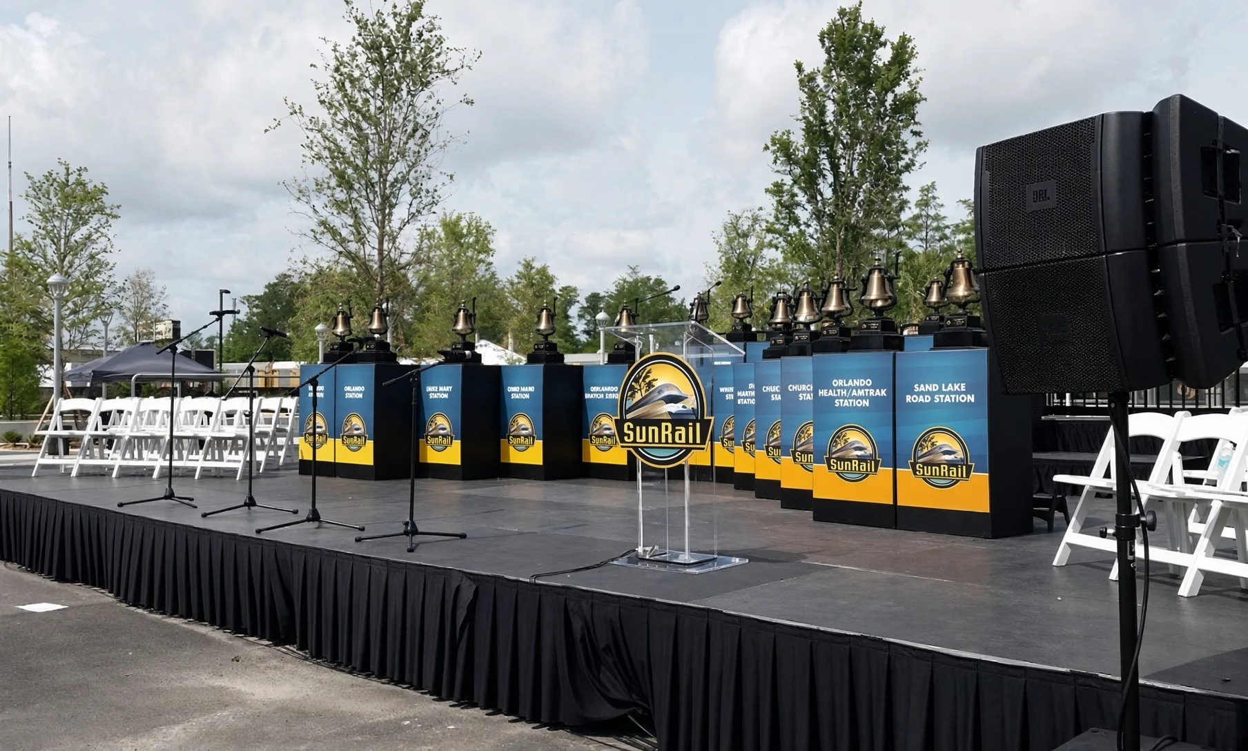 Municipal ceremony stage with microphones and public-address system